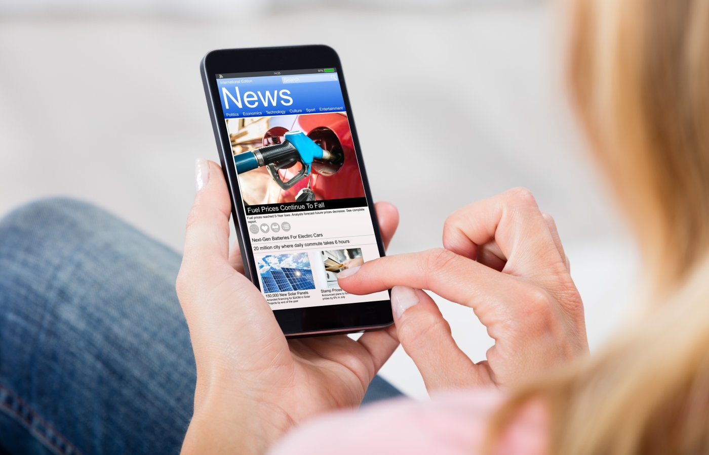 woman reading news on a mobile phone