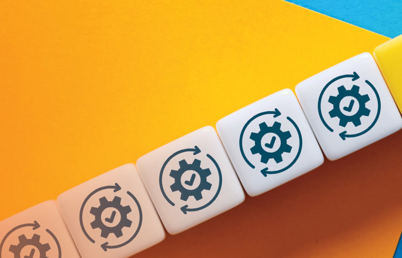 multiple gears with an arrow pointing upwards on blue and yellow background