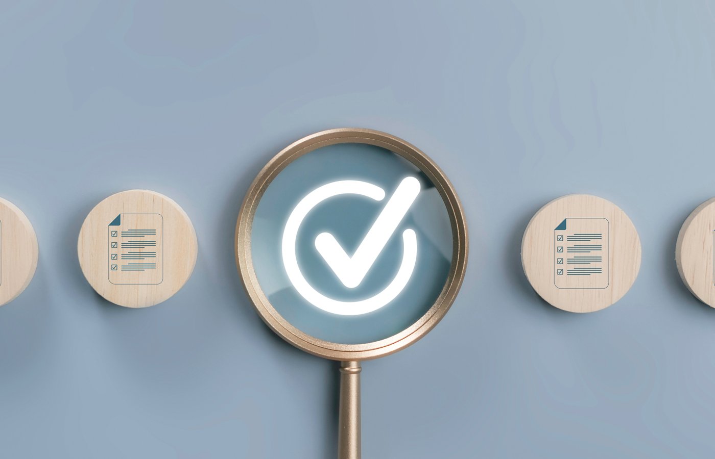 image of magnifying glass hi lighting a check mark
