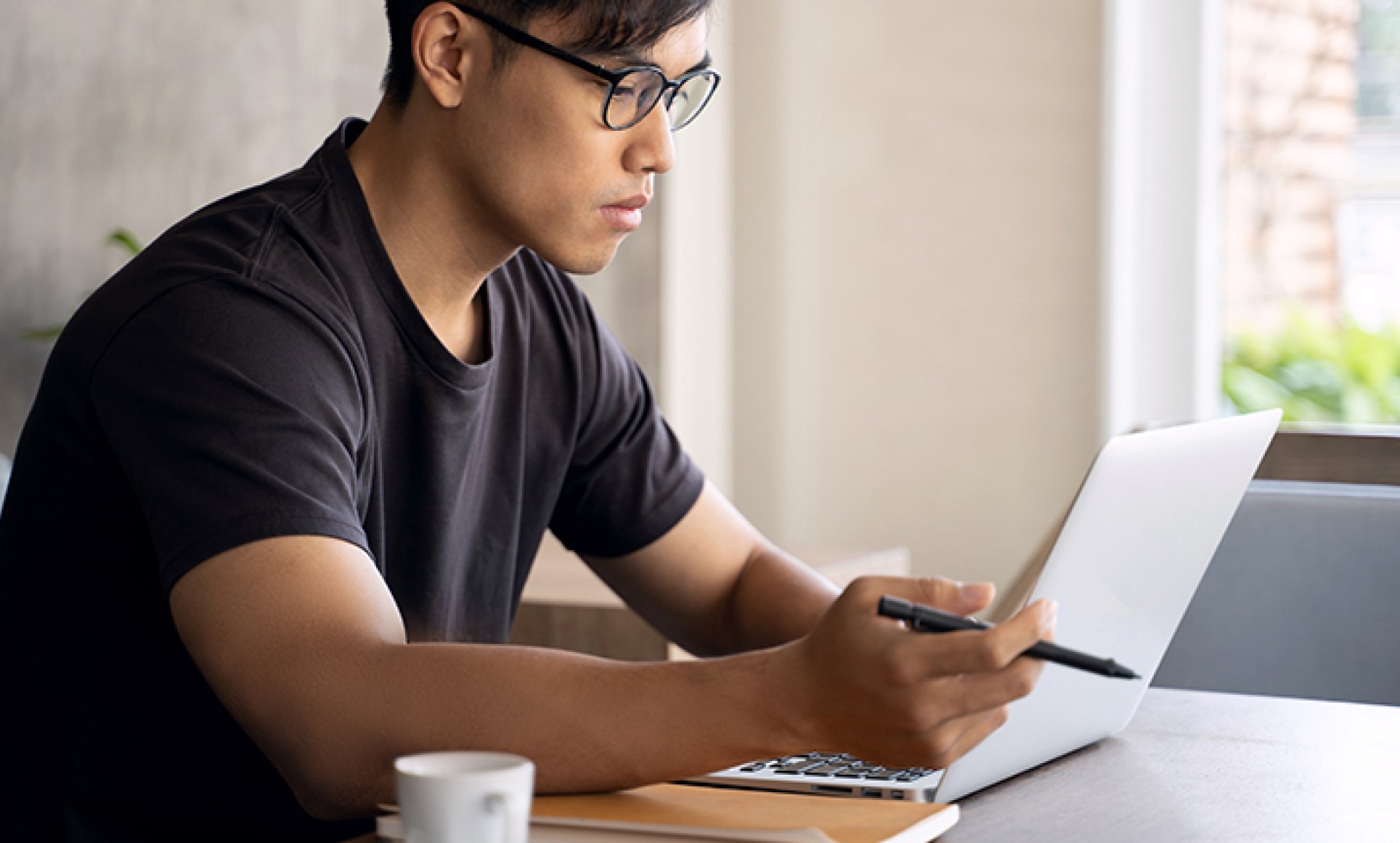 man looking at laptop