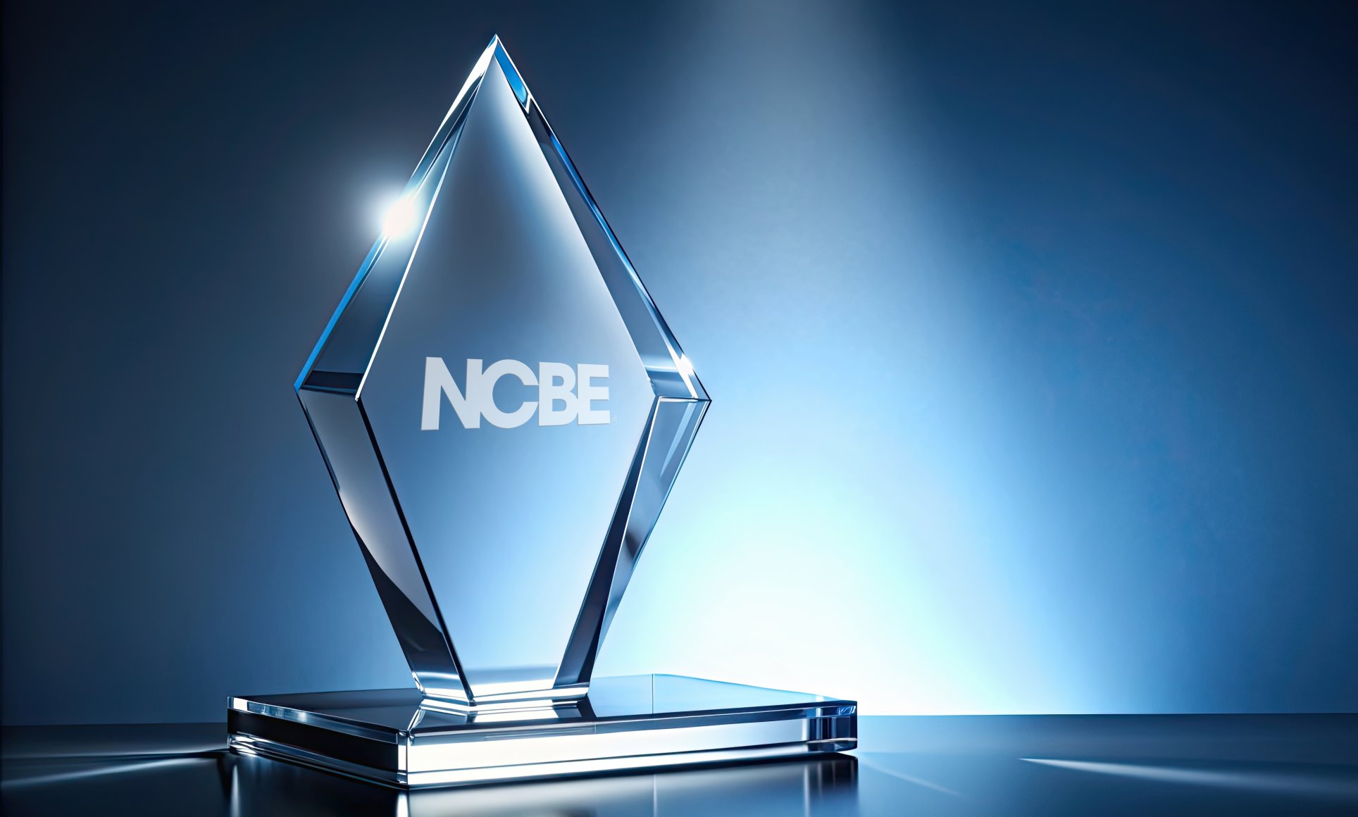 glass award that says NCBE