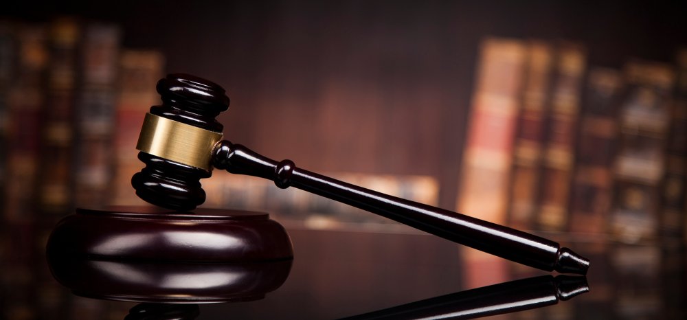 courtroom gavel with books