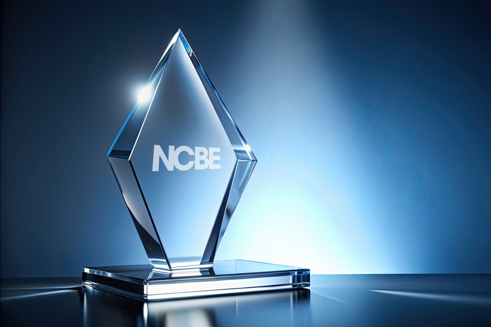 glass award that says NCBE